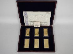 A Windsor Mint, limited edition, 24ct gold plated Pounds Ingots set,