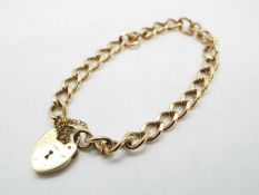 A 9 carat gold chain bracelet with padlock clasp, the chain approx 19 cm (length), approx weight 12.