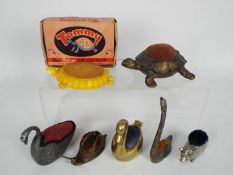 A quantity of novelty, animal form pin cushions to include tortoise, pig, swans and a snail,