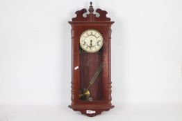 A modern Rapport mahogany cased wall clock.