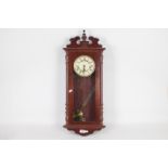 A modern Rapport mahogany cased wall clock.