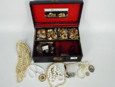 A jewellery box containing a large quantity of good quality costume jewellery