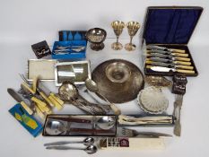 A quantity of flatware, plated and stainless, part boxed,