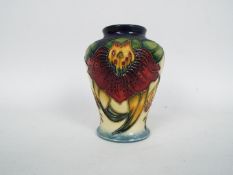Moorcroft - A small Moorcroft Pottery vase decorated in the Anna Lily pattern, dated '98,