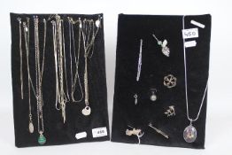Costume Jewellery - two displays of silver jewellery predominantly necklaces and brooches