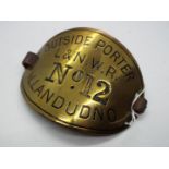 Railwayana - LNWR brass armband, Outside Porter L&NWR No 12 Llandudno, with leather strap.