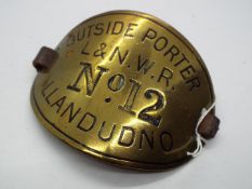 Railwayana - LNWR brass armband, Outside Porter L&NWR No 12 Llandudno, with leather strap.