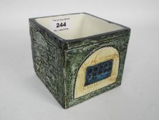 Troika Pottery - a Cube Vase with relief decoration, decorator's monogram to the base for Sue Lowe,