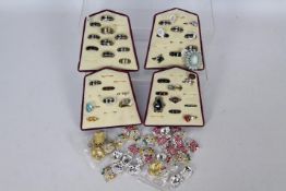 Costume Jewellery - four jewellery displays containing approximately 35 rings of various designs