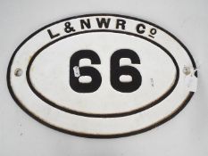 Railwayana - An oval bridge plate, 66, marked L & N W R Co, approximately 30 cm x 45 cm.