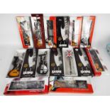 Twelve miniature ornamental Guitars with stands, all appear mint in original window boxes,