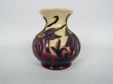 Moorcroft - A small Moorcroft Pottery vase decorated in the Pasque Flower pattern,