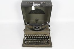 A vintage Imperial Good Companion portable typewriter in carry case.