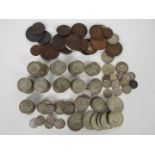 A collection of pre decimal UK coins, predominantly shillings and two shillings,