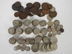 A collection of pre decimal UK coins, predominantly shillings and two shillings,