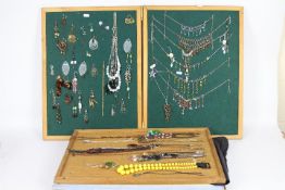 Costume Jewellery - five display boards containing a quantity of necklaces and paired earrings