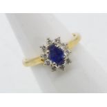 An 18ct yellow gold sapphire and diamond cluster ring, size M, approximately 4 grams all in.