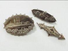 Three early hallmarked silver brooches to include an oval example engraved with a depiction of