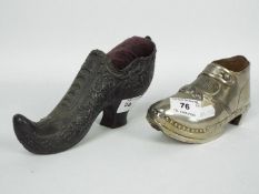 A large, Victorian, pewter pin cushion in the form of a shoe,