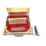 A vintage Scandalli accordion contained in carry case and a Hohner harmonica and one other.