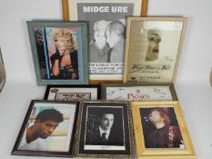 A quantity of framed images of musicians, performers and theatre posters,