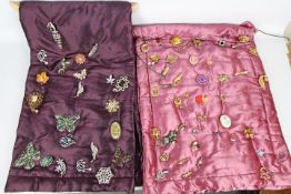 Costume Jewellery - a display containing in excess of 65 brooches with various designs