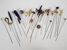 A quantity of vintage hat and veil pins.