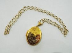 A hallmarked 9 carat gold chain and an unmarked yellow metal locket, the chain weighing approx 4.