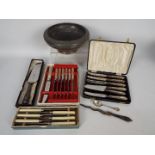 A cased set of six silver handled butter knives, silver handled cake slice, silver coffee spoon,