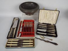 A cased set of six silver handled butter knives, silver handled cake slice, silver coffee spoon,