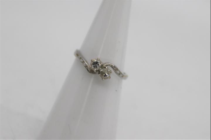 A white metal two stone diamond ring, pr