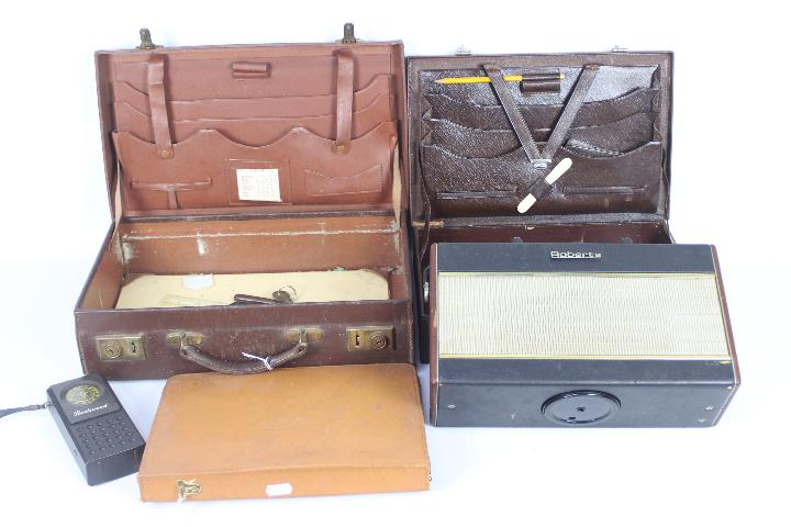 Two vintage brief cases, a Roberts radio