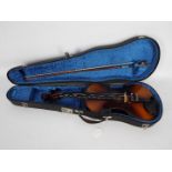 A violin (approximately 21.5 cm length)