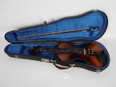 A violin (approximately 21.5 cm length)