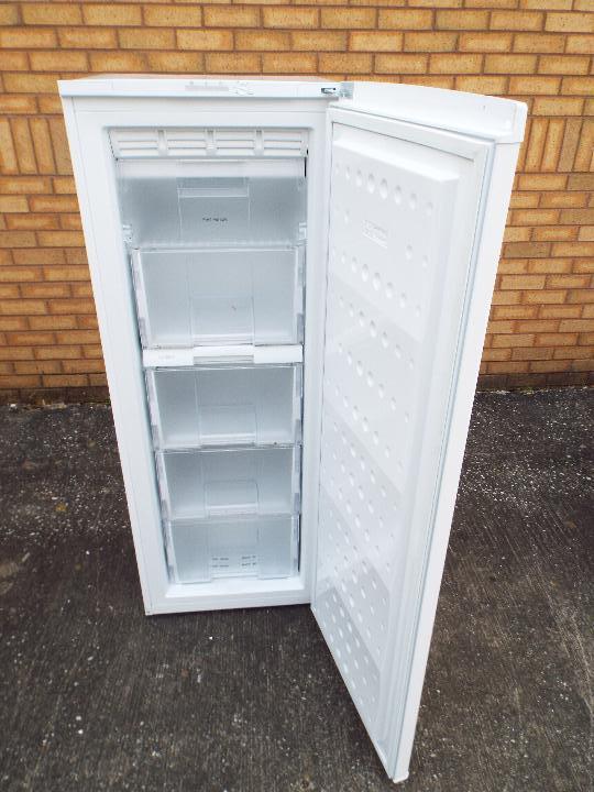 A white Beko freezer, approximately 145