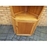 Ercol - An Ercol corner cabinet measuring approximately 179 cm x 70 cm x 42 cm.