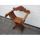 A Savonarola type folding chair,