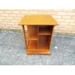 A vintage revolving bookcase, measuring