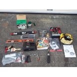 A mixed lot of tools to include a ratchet strap set, a box of new paint brushes,