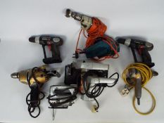 A mixed power tool lot to included drills, a planer. a circular saw and similar.