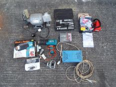 A collection of various tool to include a Hilka 6" bench grinder 1/2 HP 3000 rpm, a hot air gun,
