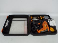 A worx drill kit in box with tape drill bits and drill handle.