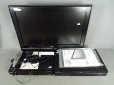 A JVC 26" television, Humax Freeview box and a Panasonic DVD player.