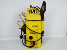 A Karcher pressure washer K 2.36 with two cleaning nozzles.