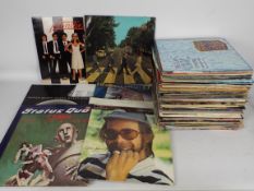 A quantity of 12" vinyl records to inclu