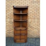 Ercol - An Ercol corner cabinet measurin