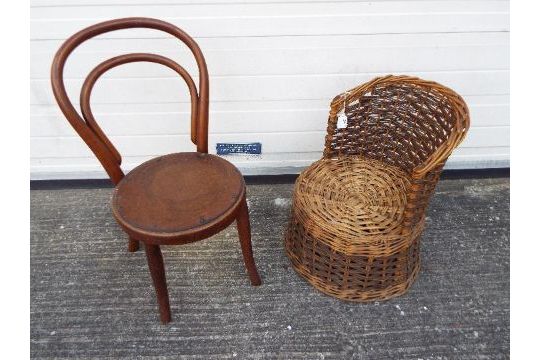 Two children's chairs, one a wicker tub style chair, the other a bentwood example.