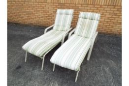 A pair of sun loungers. [2]