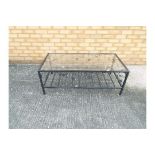 A glass topped, black framed coffee table, approximately 40 cm x 110 cm x 55 cm.