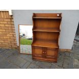 Ercol - A Waterfall bookcase with lower